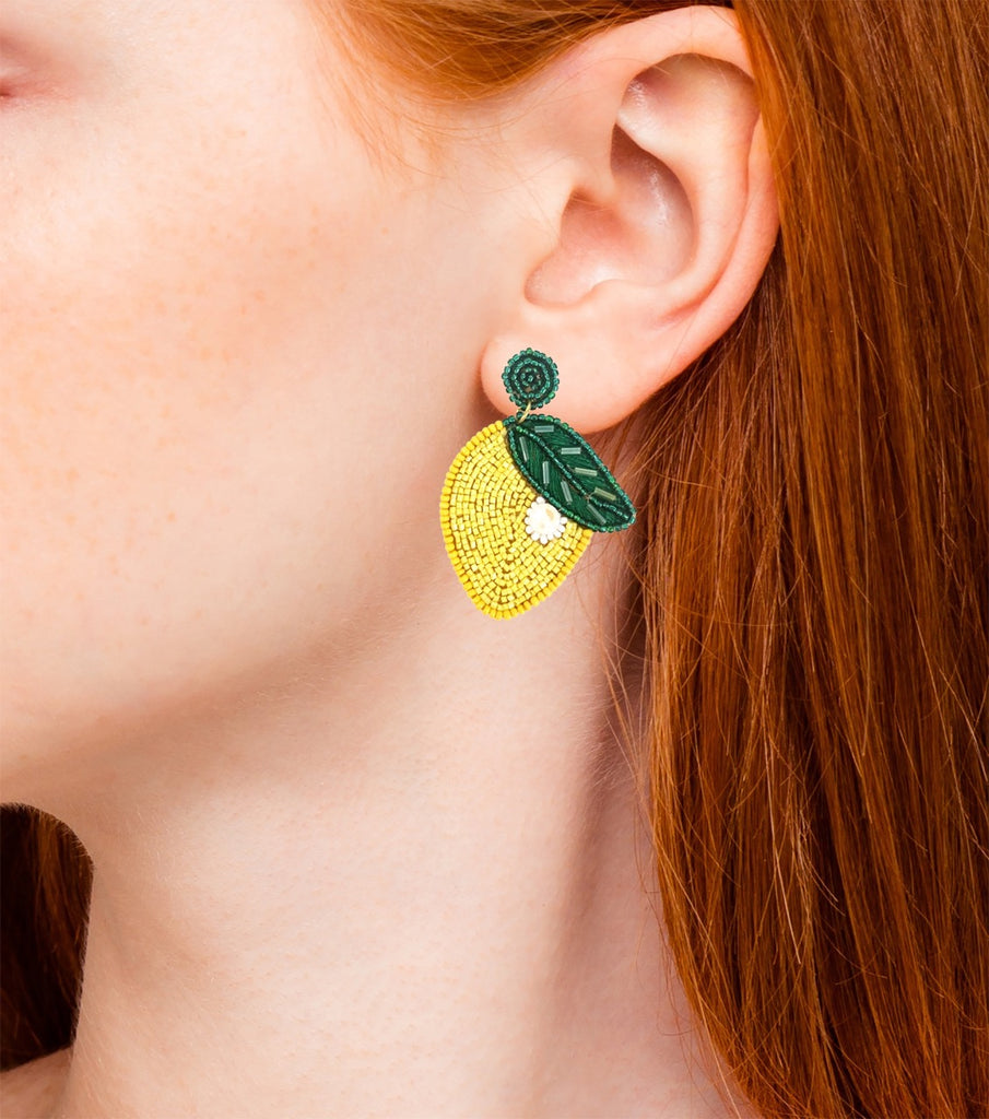 Handmade lemon drop earrings, featuring a quirky lemon and lips design, perfect for warm-weather styling.