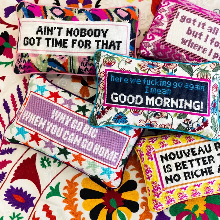 Vibrant throw pillows with quirky quotes and bold design, perfect for adding a statement to any room.