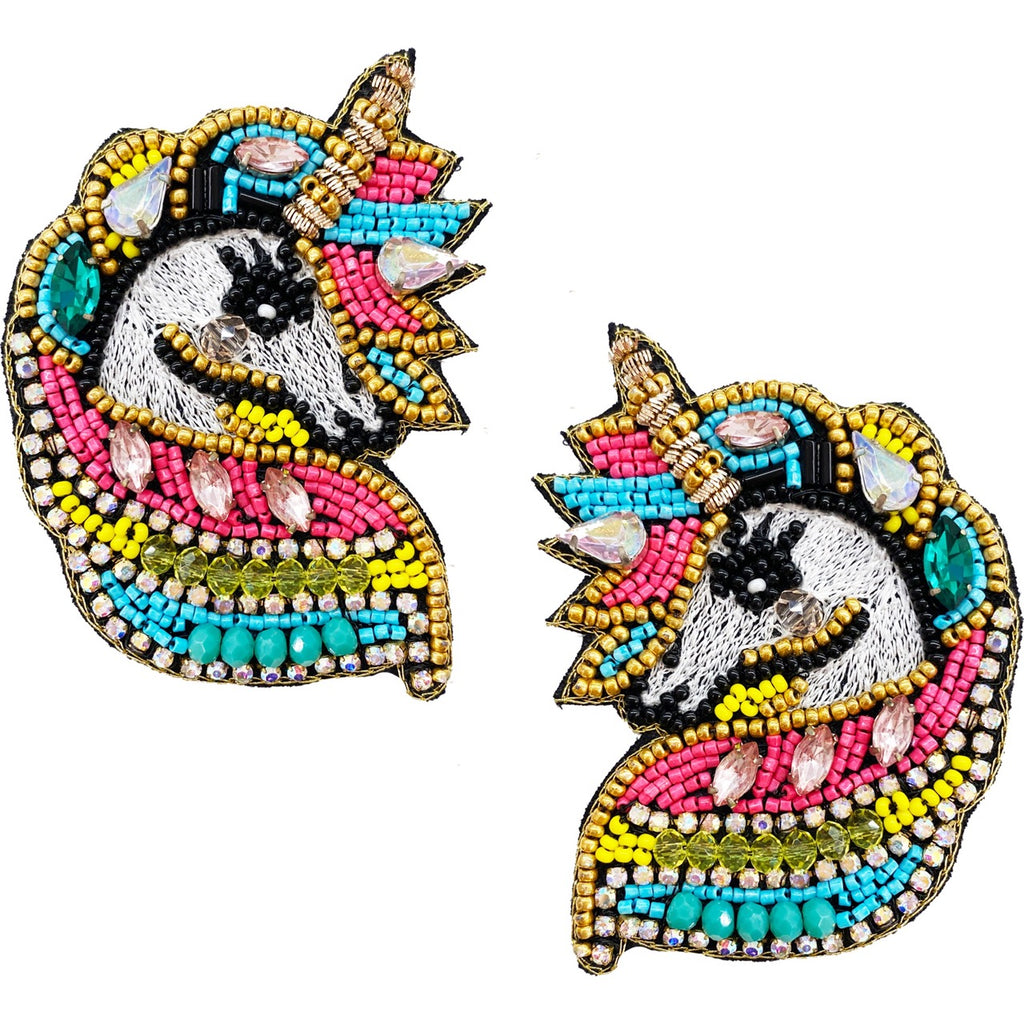 Whimsical unicorn earrings with colorful beads, rainbows, and roller skate details, perfect for a bold look.