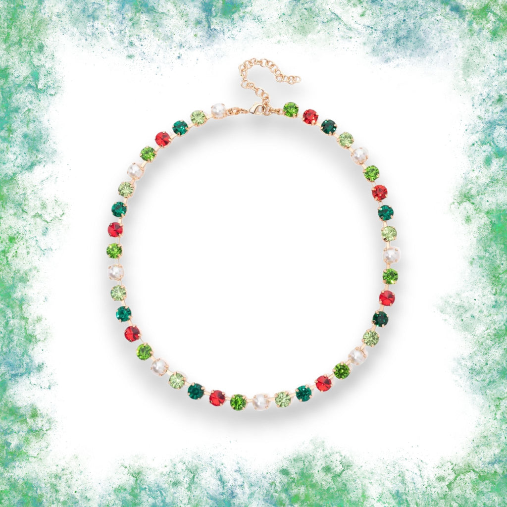 Stylish holiday necklace featuring red and green crystals with pearls on a gold chain, perfect for any festive occasion.