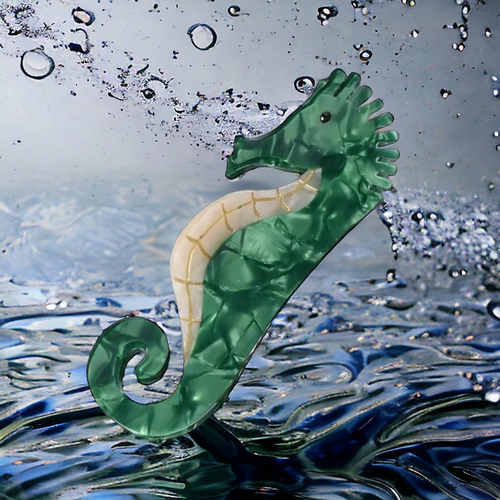 Stylish hair clip adorned with a vibrant seahorse silhouette made of durable resin, adding a touch of whimsy and sophistication to any hairstyle.
