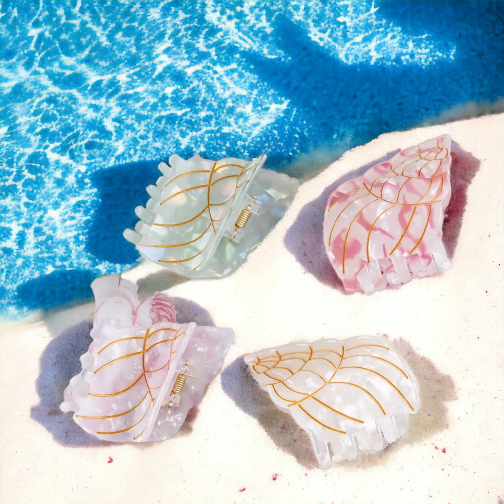 Cute conch shell-shaped hair clips, perfect for a fun and fashionable look.