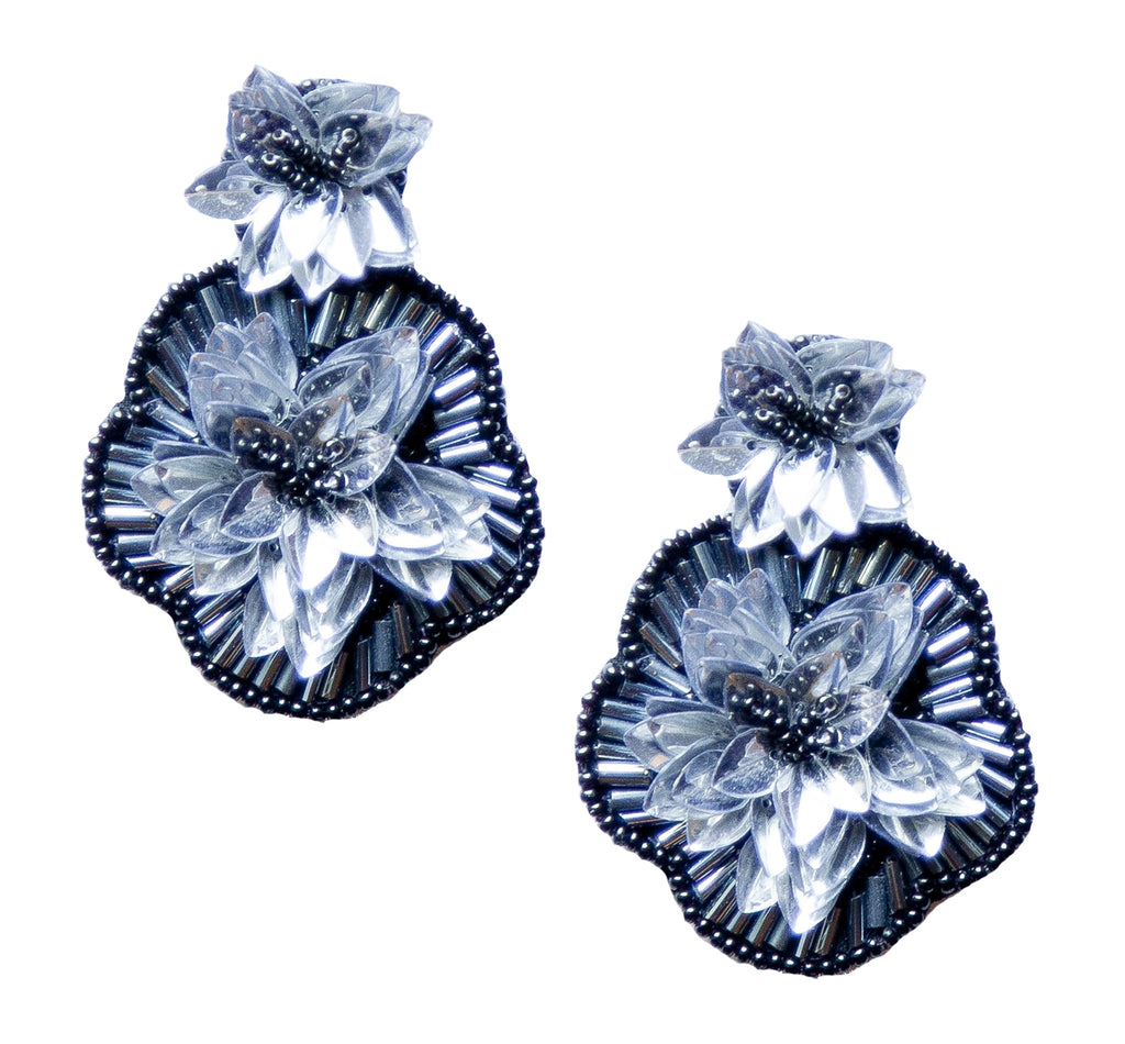 Handcrafted silver lily drop earrings with intricate beading and fun patch designs.