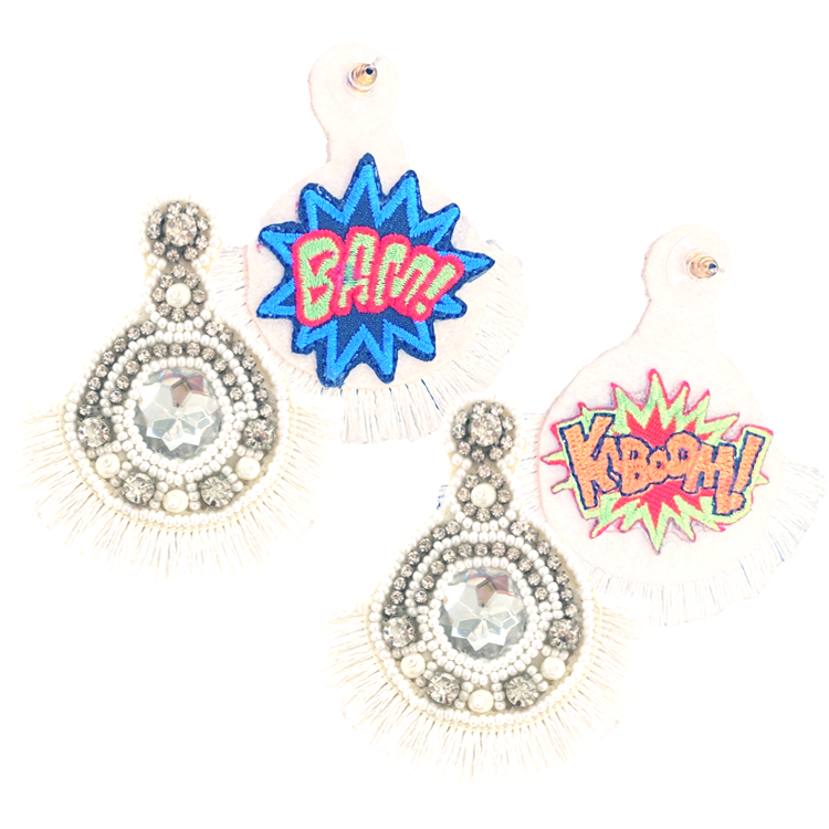 Space Oddity White Earrings adorned with rhinestones, pearls, and fun Bam! Kaboom! patches for a unique look.