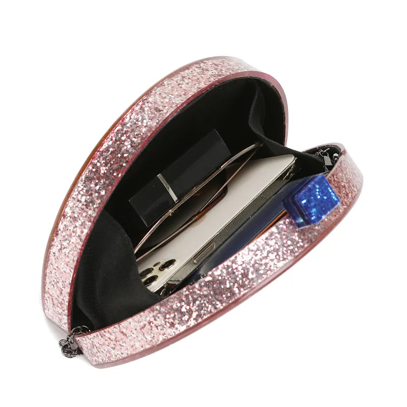 Glittery rainbow acrylic clutch purse with bold colors and a removable chain strap.