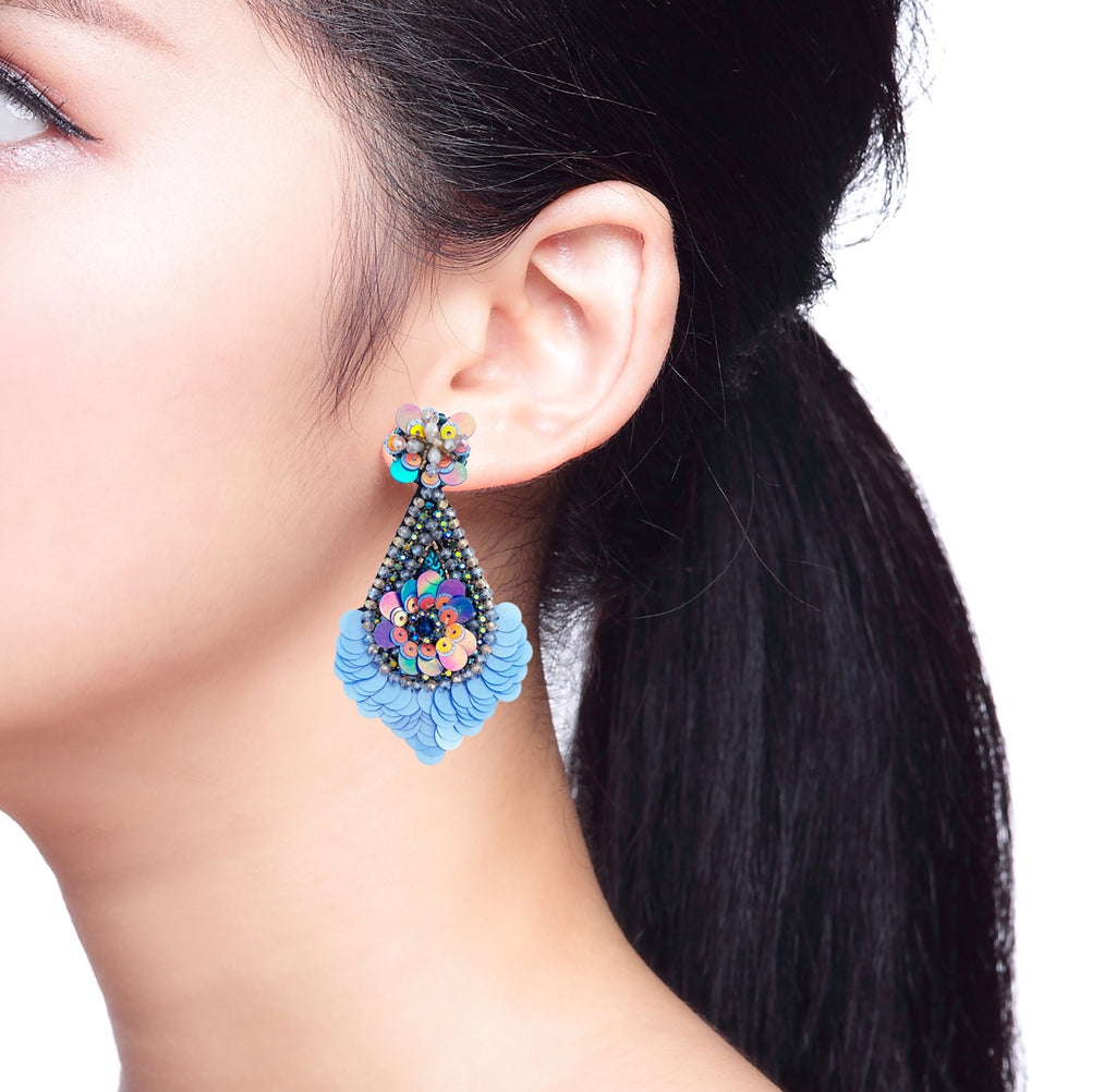 Glamorous drop earrings adorned with shimmering sequins and a "Love Trumps Hate" patch, perfect for special occasions.