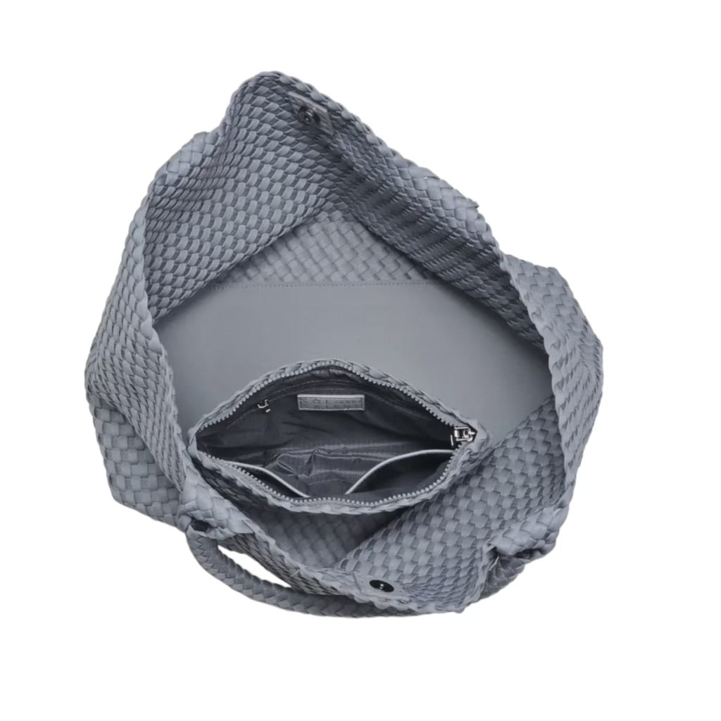 Stylish grey tote featuring a unique basketweave design and a roomy interior, ideal for carrying all your essentials.