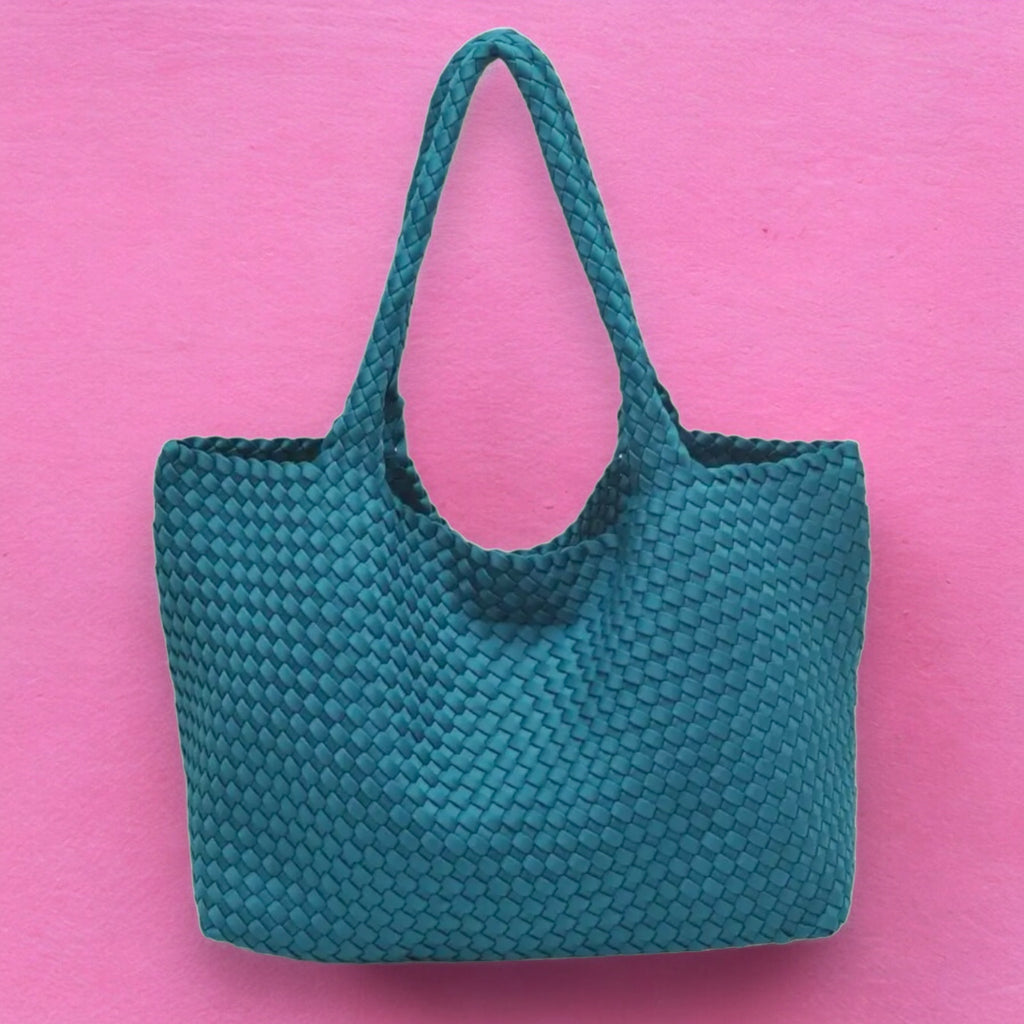 Elegant teal basketweave tote, crafted from water-resistant neoprene, perfect for adding a stylish touch to your beach or city outings.