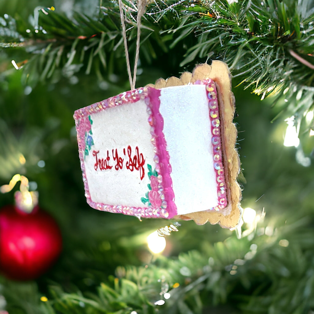 Playful resin Christmas ornament shaped like a slice of cake with "Treat Yo' Self" message, ideal for holiday decorating.