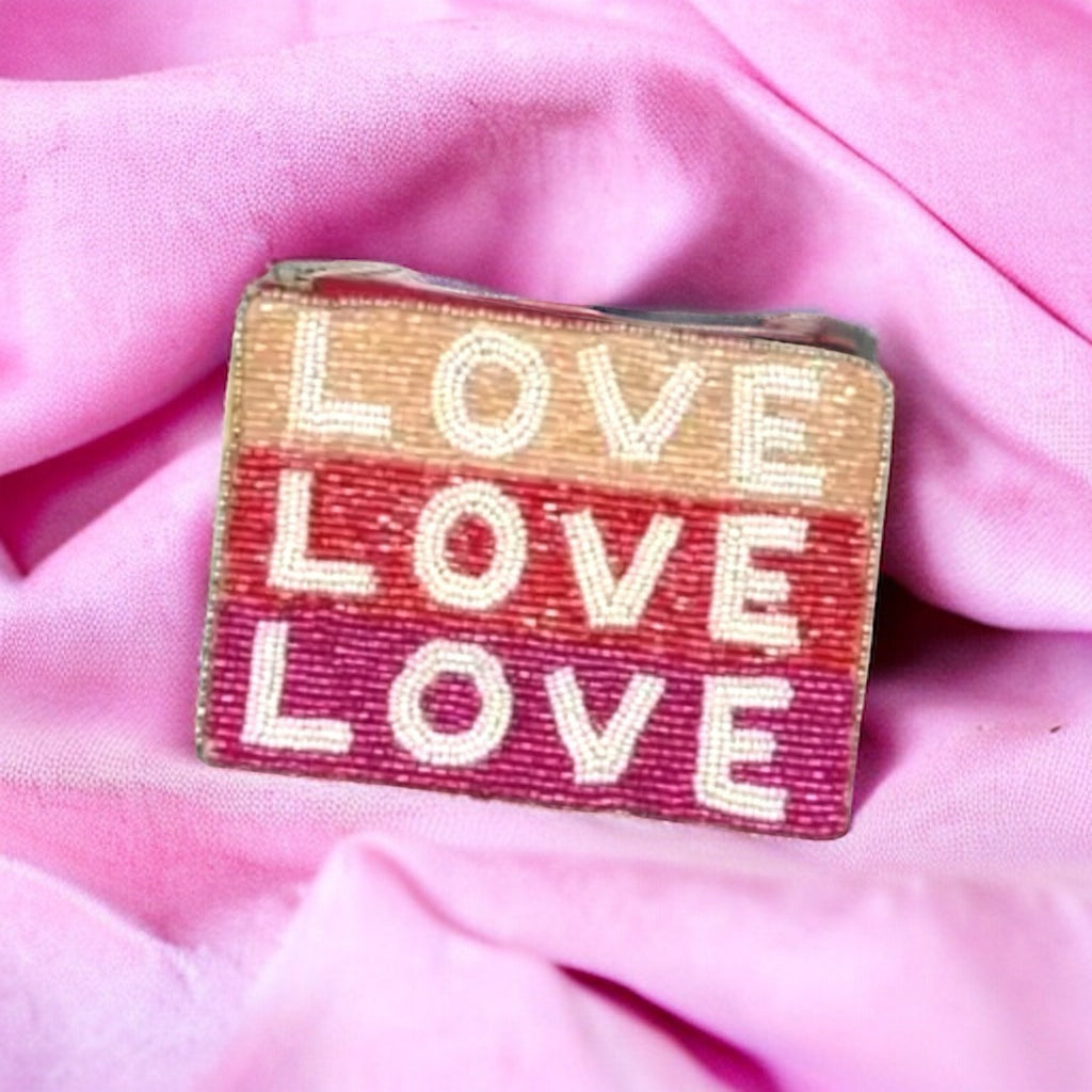 Triple Love Beaded Coin Pouch featuring "LOVE" beads in soft pink tones, perfect for carrying small essentials.