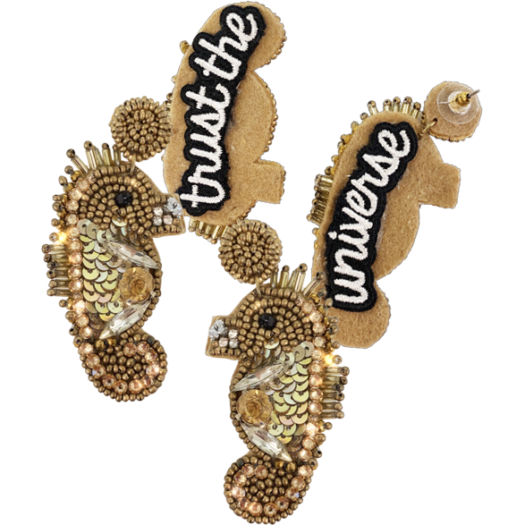 Gold beaded seahorse earrings with rhinestone details and "Trust the Universe" patch, perfect for a nautical chic look.