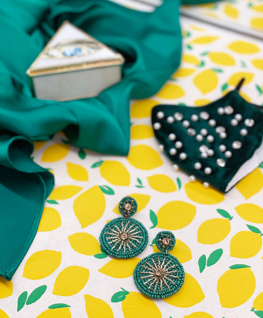 Fashion earrings in emerald green with a unique circular starburst pattern, ideal for casual and formal wear.