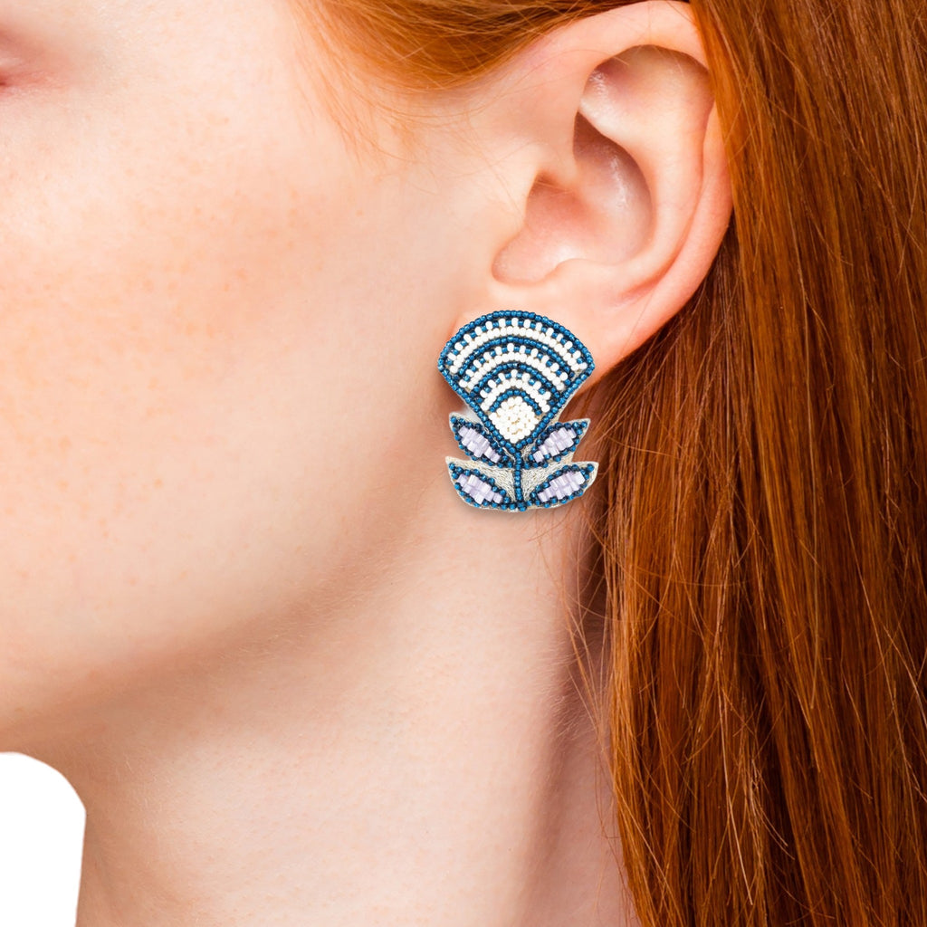 Elegant blue beaded earrings with Aztec-inspired lily design.