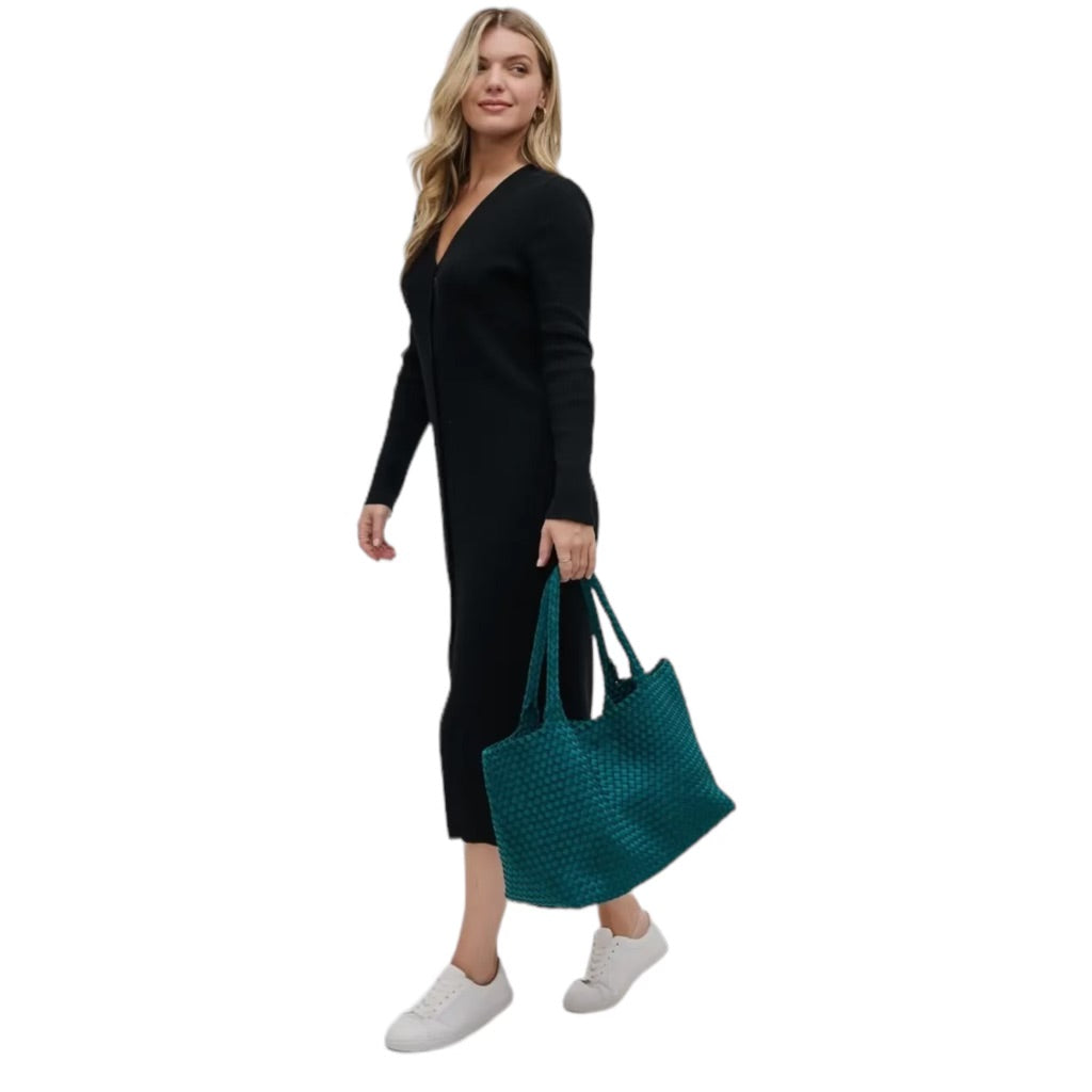 Teal neoprene tote with a basketweave pattern, offering a roomy interior and versatile style for any occasion.