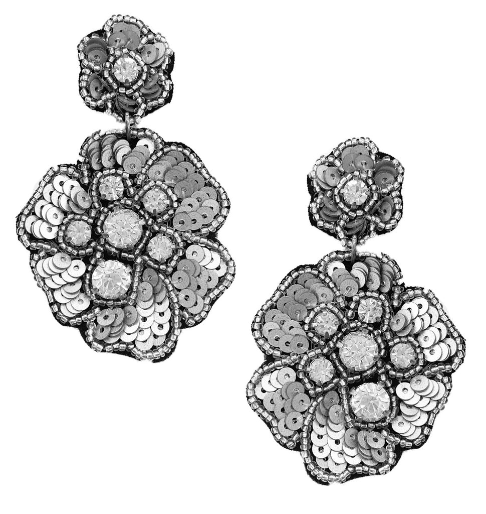 Unique magnolia earrings with a double-drop design and bold "WTF" patches, offering a blend of elegance and attitude.