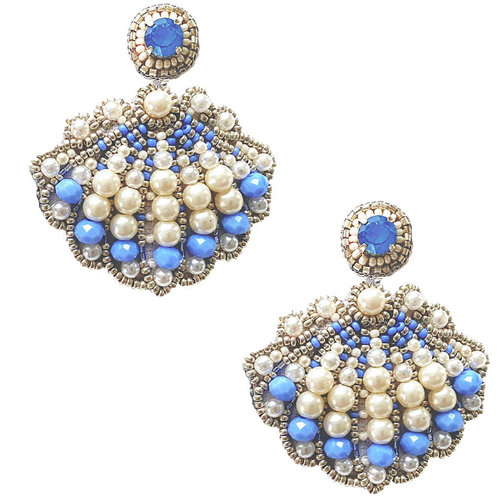 Lightweight blue and white shell earrings with pearl details and playful patch design.