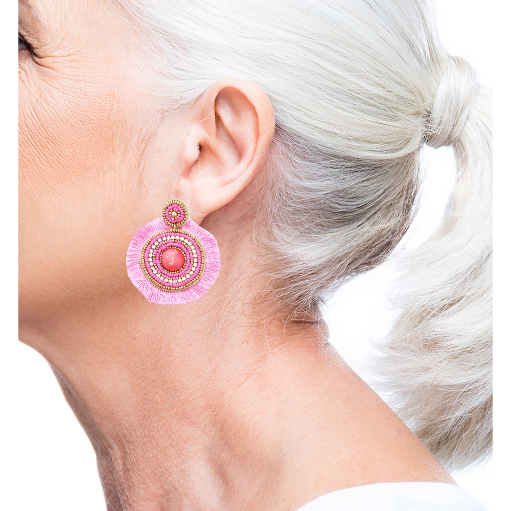 Lightweight pink statement earrings with plush fringe and unique champagne-themed patches, hypoallergenic.