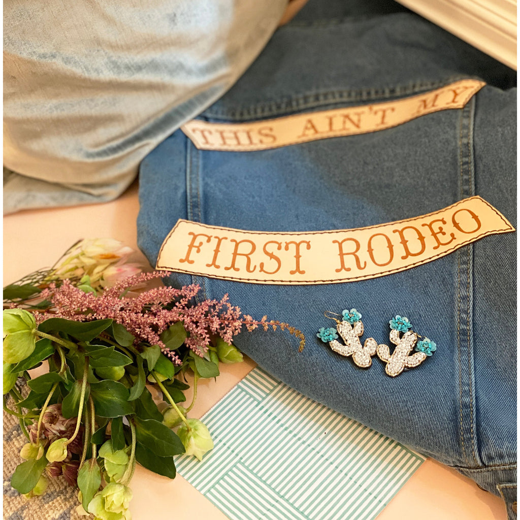 Trendy white embroidered cactus flower earrings perfect for casual and festival looks.