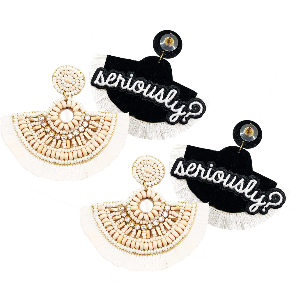 Ivory fan-shaped earrings with intricate detailing and a playful "Seriously?" patch.