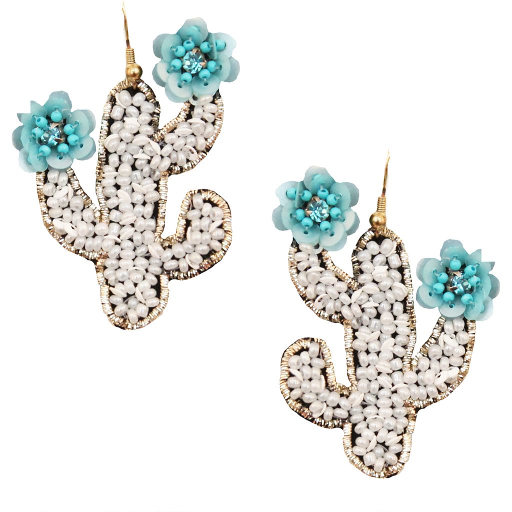 Boho chic cactus earrings featuring floral embroidery in white and teal colors.