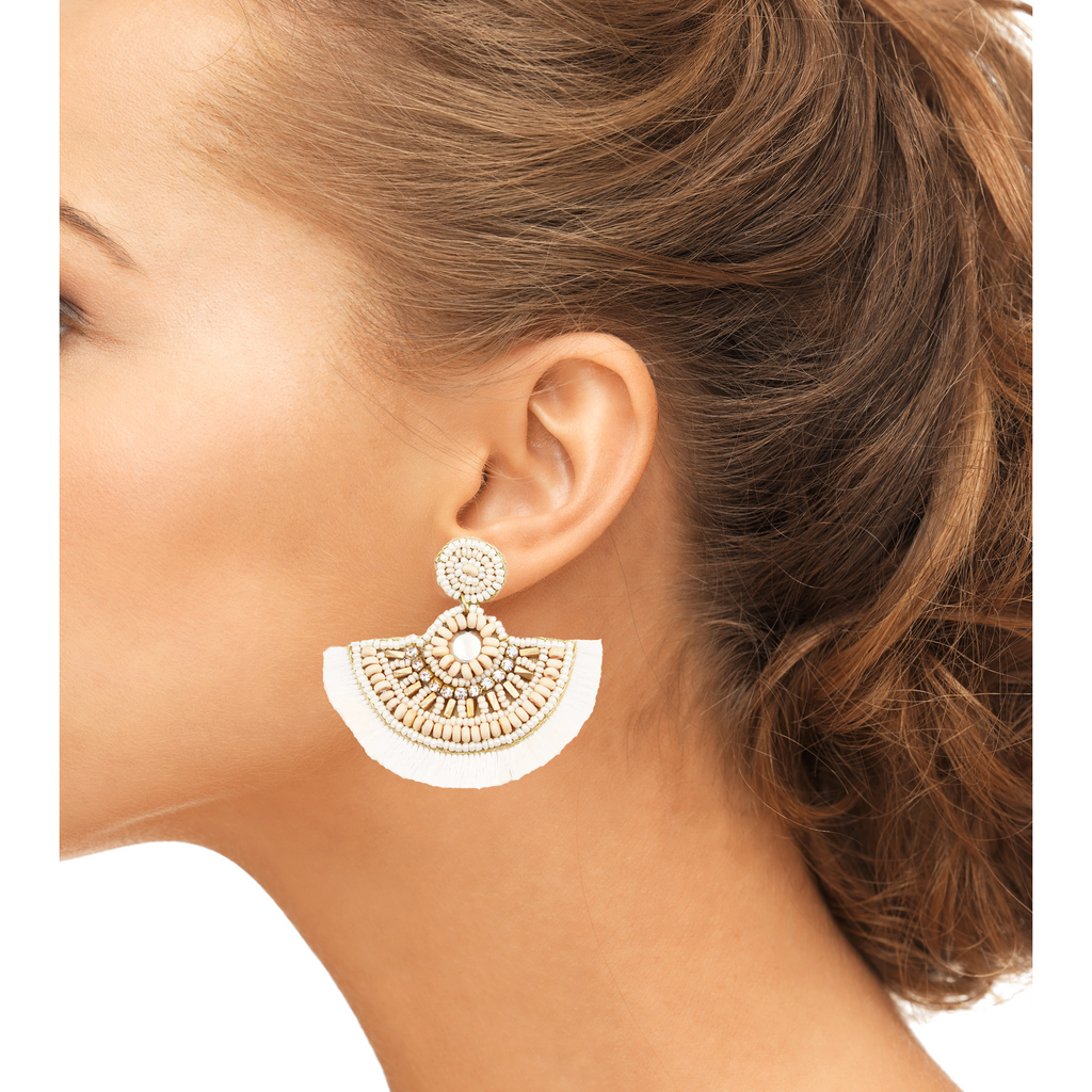 Bold fan-shaped ivory earrings with unique detailing and lightweight construction.