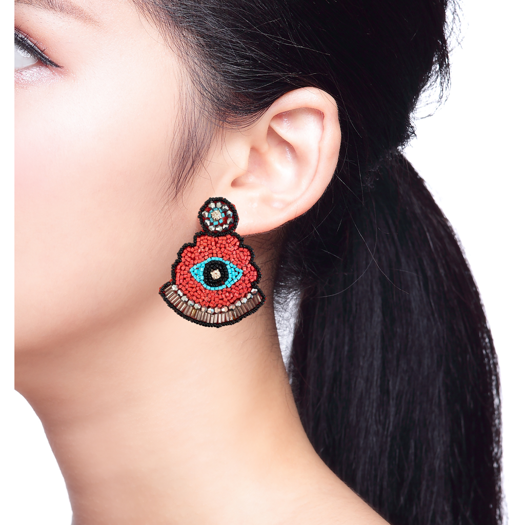 Lightweight, handcrafted earrings featuring vibrant red and blue colors with mystical designs.